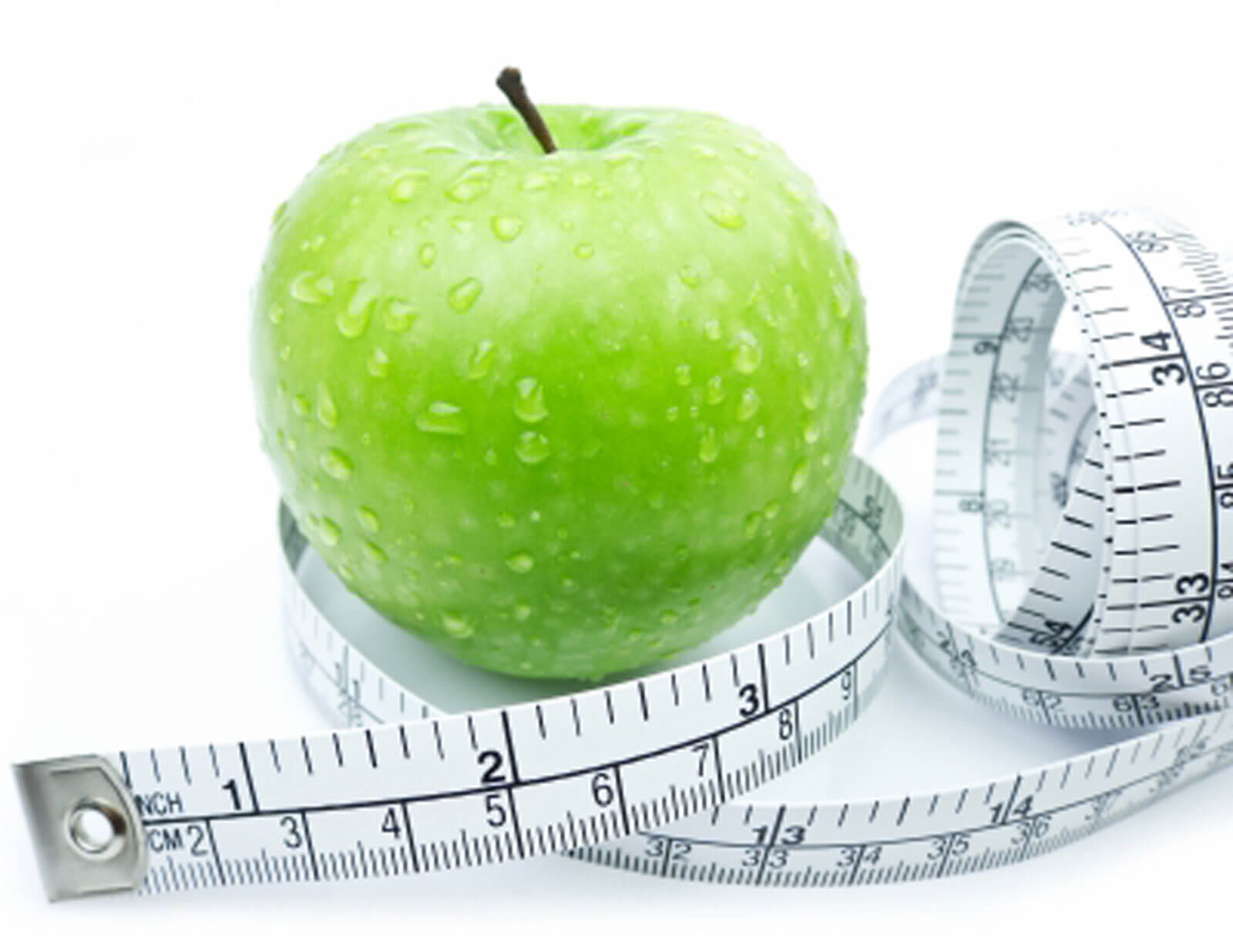 Фруктовый см. Яблоко с сантиметром. Зеленое яблоко и сантиметр. Яблоко с измерительной лентой. Разгрузочный день на яблоках.